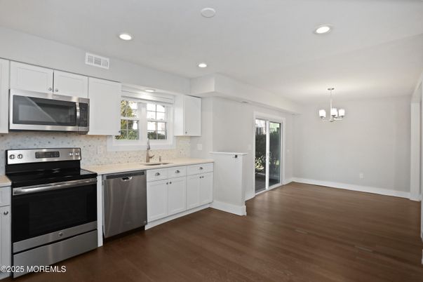 Chandelier, Interior, Kitchen, Pendant Lights, Recessed Lighting, Stainless Steel Appliances, Wood Texture Flooring