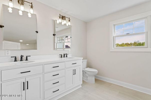 Bathroom, Dual Sink Vanities, Interior, Recessed Lighting, Wood Texture Flooring