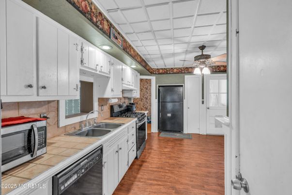 Interior, Kitchen, Tile Countertops, Wood Texture Flooring