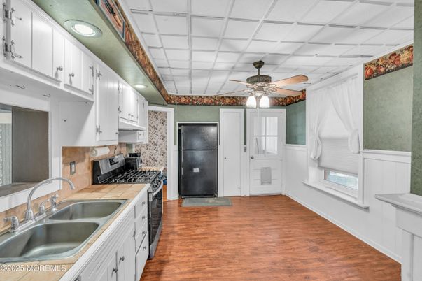 Interior, Kitchen, Recessed Lighting, Tile Countertops, Wood Texture Flooring