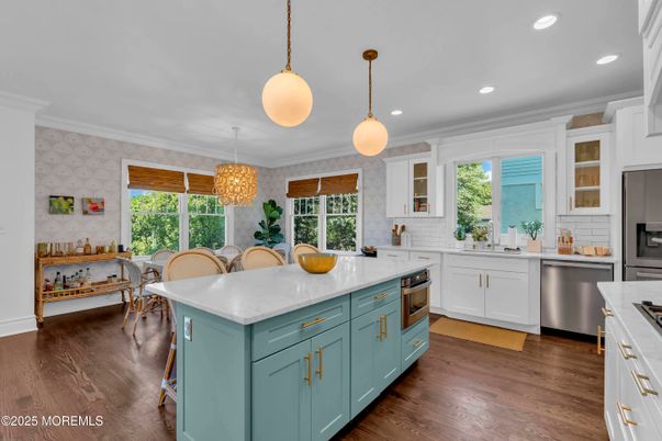 Chandelier, Dining room, Interior, Kitchen, Pendant Lights, Recessed Lighting, Stainless Steel Appliances, Wood Texture Flooring