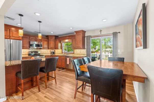 Dining room, Interior, Kitchen, Pendant Lights, Recessed Lighting, Stainless Steel Appliances, Wood Texture Flooring
