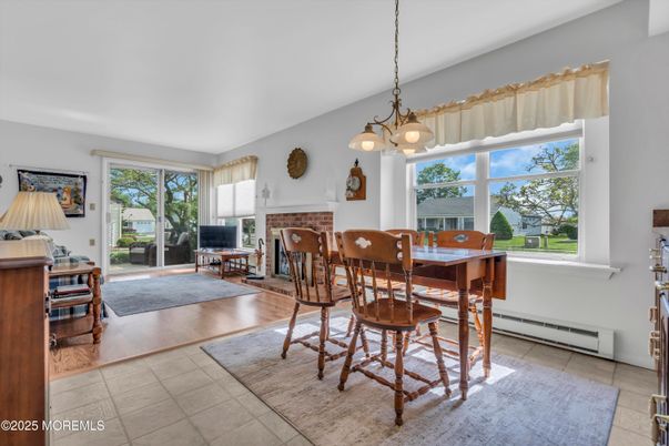 Dining room, Fireplace, Interior, Pendant Lights, Wood Texture Flooring