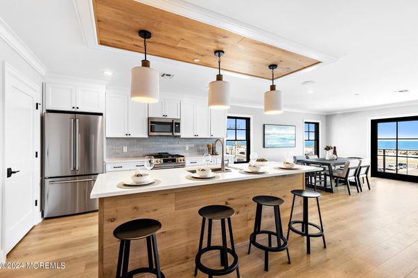 Dining room, Interior, Kitchen, Pendant Lights, Recessed Lighting, Stainless Steel Appliances, Water, Wooden Ceilings, Wood Texture Flooring
