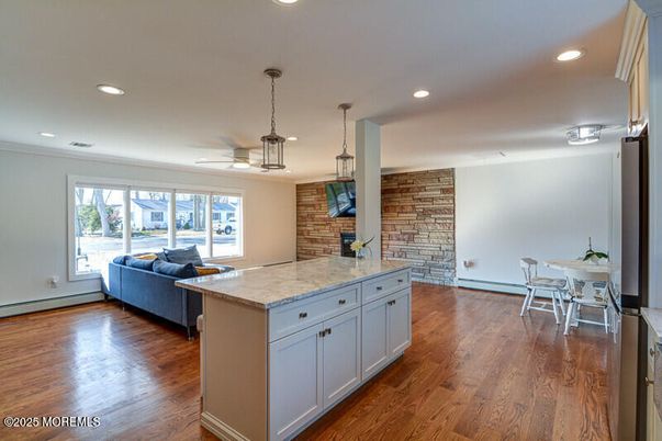 Dining room, Interior, Living room, Pendant Lights, Recessed Lighting, Stone Walls, Wood Texture Flooring