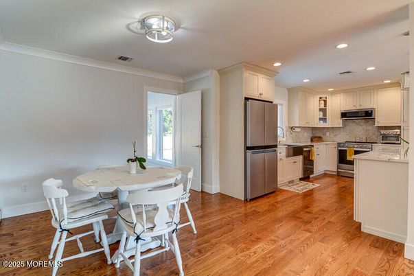 Dining room, Interior, Kitchen, Recessed Lighting, Stainless Steel Appliances, Wood Texture Flooring
