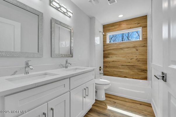 Bathroom, Dual Sink Vanities, Interior, Recessed Lighting, Wood Texture Flooring, Wooden Walls