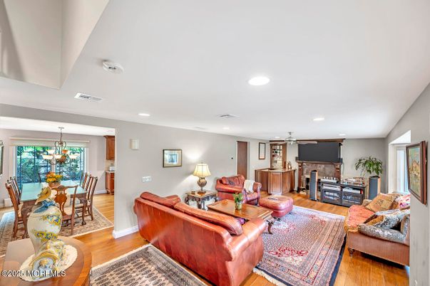 Chandelier, Dining room, Fireplace, Interior, Living room, Recessed Lighting, Wood Texture Flooring