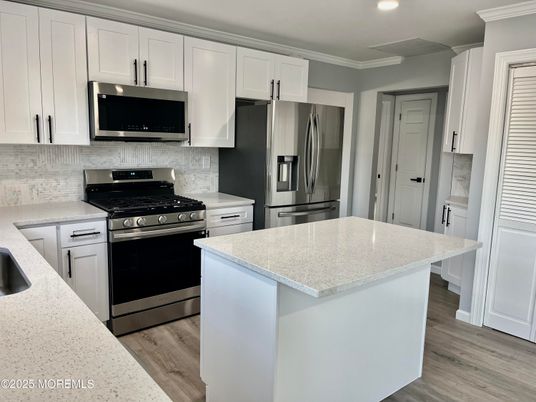 Interior, Kitchen, Recessed Lighting, Stainless Steel Appliances, Wood Texture Flooring