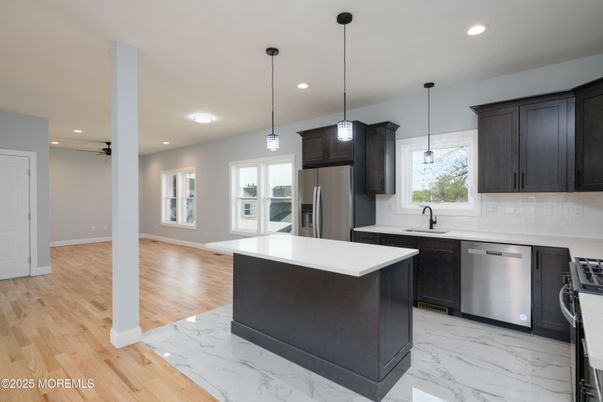 Interior, Kitchen, Marble, Pendant Lights, Recessed Lighting, Stainless Steel Appliances, Wood Texture Flooring