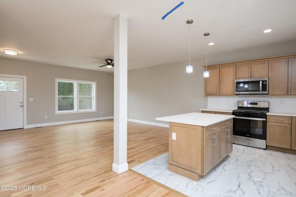 Interior, Kitchen, Marble, Pendant Lights, Recessed Lighting, Stainless Steel Appliances, Wood Texture Flooring