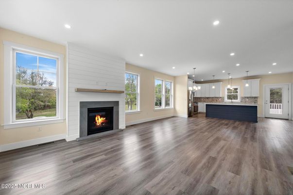 Empty room, Fireplace, Interior, Kitchen, Pendant Lights, Recessed Lighting, Wood Texture Flooring