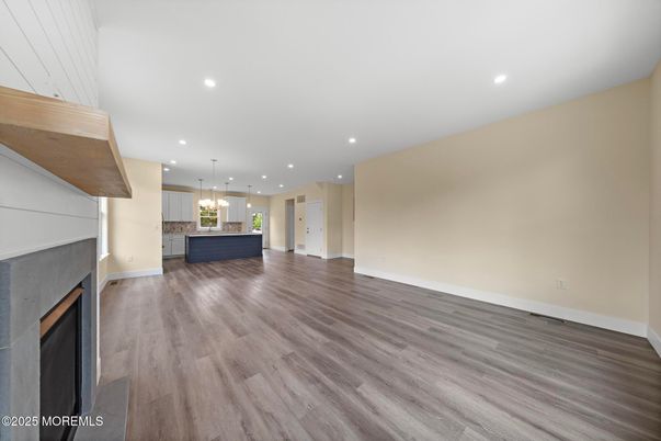Empty room, Fireplace, Interior, Kitchen, Pendant Lights, Recessed Lighting, Wood Texture Flooring