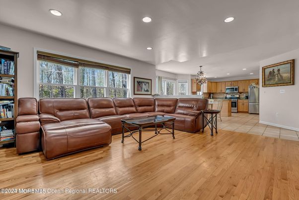 Chandelier, Interior, Kitchen, Living room, Recessed Lighting, Stainless Steel Appliances, Wood Texture Flooring