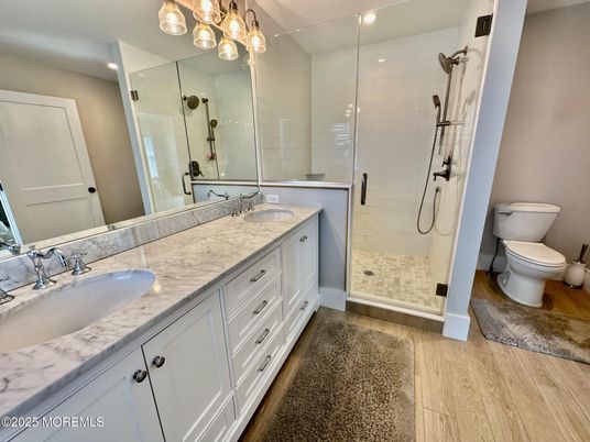 Bathroom, Dual Sink Vanities, Glass Shower, Interior, Recessed Lighting, Wood Texture Flooring