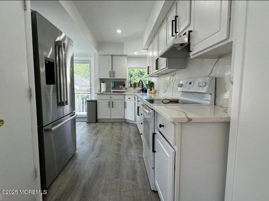 Interior, Kitchen, Marble Walls, Recessed Lighting, Stainless Steel Appliances, Wood Texture Flooring