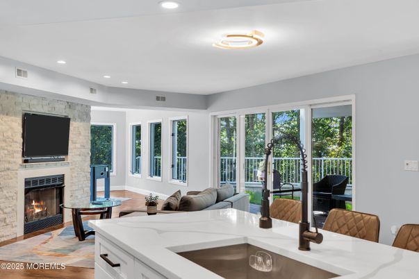 Fireplace, Interior, Living room, Piano, Recessed Lighting, Stone Walls, Wood Texture Flooring