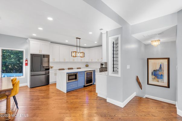 Chandelier, Interior, Kitchen, Pendant Lights, Recessed Lighting, Stainless Steel Appliances, Wood Texture Flooring