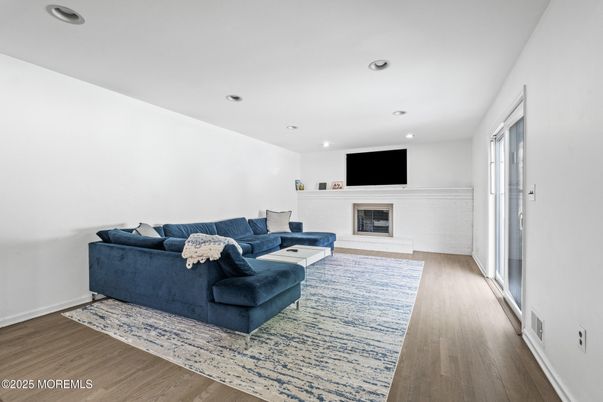 Fireplace, Interior, Living room, Recessed Lighting, Wood Texture Flooring