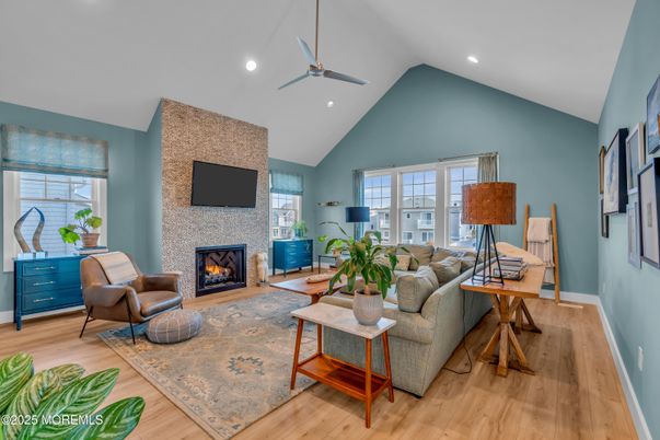 Fireplace, Interior, Living room, Recessed Lighting, Stone Walls, Wood Texture Flooring