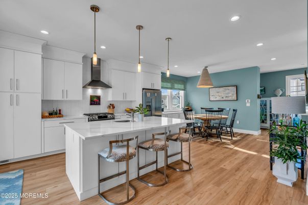 Dining room, Interior, Kitchen, Pendant Lights, Recessed Lighting, Stainless Steel Appliances, Wood Texture Flooring