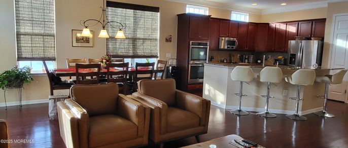 Dining room, Interior, Kitchen, Pendant Lights, Recessed Lighting, Stainless Steel Appliances, Wood Texture Flooring