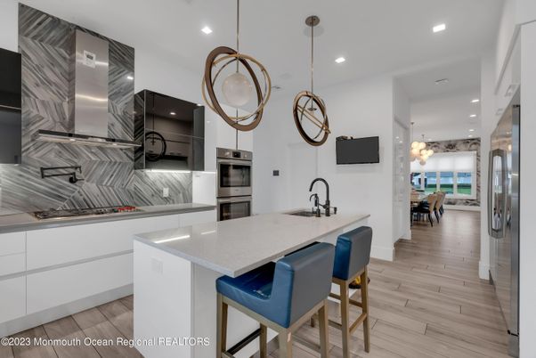 Dining room, Interior, Kitchen, Pendant Lights, Recessed Lighting, Stainless Steel Appliances, Wood Texture Flooring