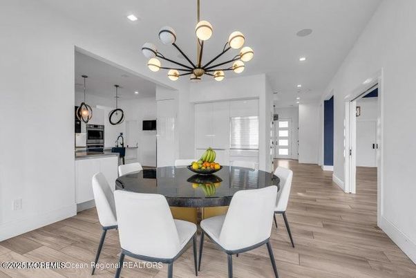Dining room, Interior, Kitchen, Pendant Lights, Recessed Lighting, Stainless Steel Appliances, Wood Texture Flooring