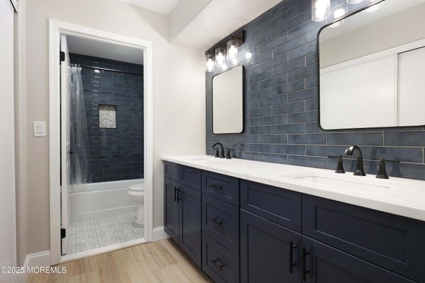 Bathroom, Dual Sink Vanities, Glass Shower, Interior, Wood Texture Flooring