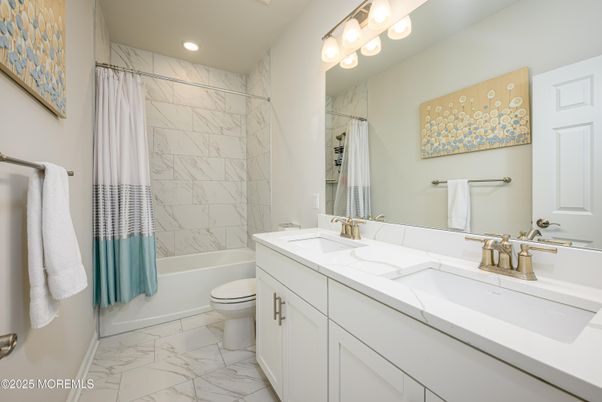 Bathroom, Dual Sink Vanities, Interior, Marble, Marble Walls, Recessed Lighting