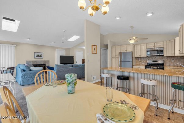 Dining room, Interior, Kitchen, Living room, Recessed Lighting, Stainless Steel Appliances, Wood Texture Flooring