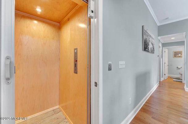 Elevator, Interior, Recessed Lighting, Wood Texture Flooring, Wooden Walls