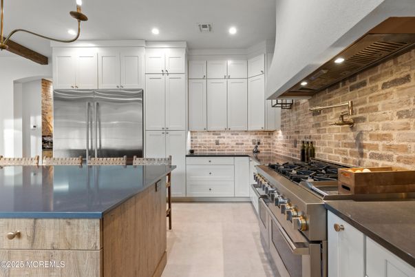 Interior, Kitchen, Recessed Lighting, Stainless Steel Appliances, Stone Walls
