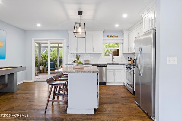 Dining room, Interior, Kitchen, Pendant Lights, Recessed Lighting, Stainless Steel Appliances, Wood Texture Flooring