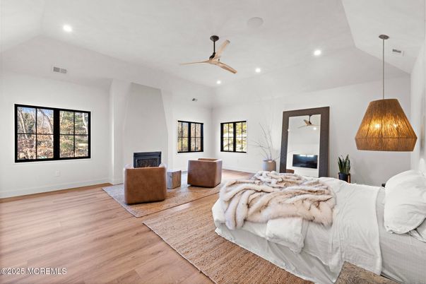 Bedroom, Fireplace, Interior, Pendant Lights, Recessed Lighting, Wood Texture Flooring