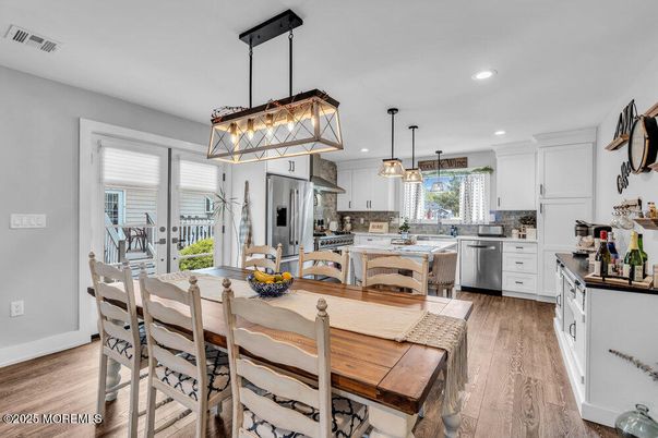 Dining room, Interior, Kitchen, Pendant Lights, Recessed Lighting, Stainless Steel Appliances, Wood Texture Flooring