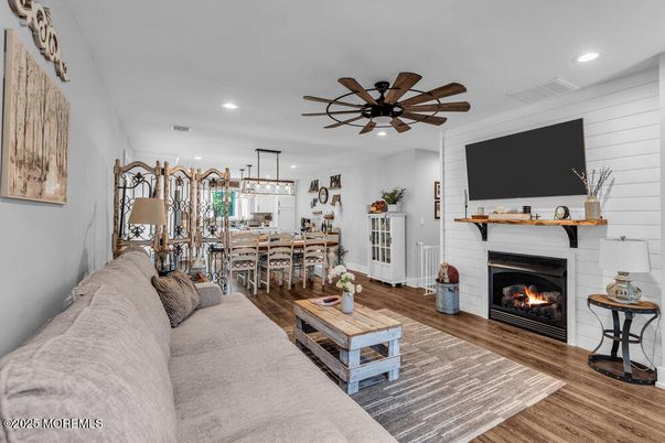 Dining room, Fireplace, Interior, Living room, Pendant Lights, Recessed Lighting, Wood Texture Flooring