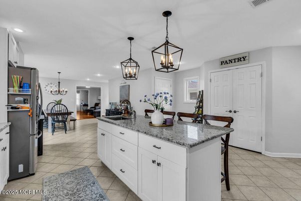 Chandelier, Dining room, Interior, Kitchen, Living room, Pendant Lights, Recessed Lighting, Stainless Steel Appliances