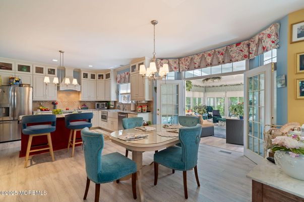 Chandelier, Dining room, Interior, Kitchen, Pendant Lights, Recessed Lighting, Stainless Steel Appliances, Wood Texture Flooring