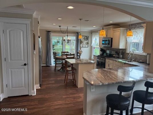 Chandelier, Dining room, Interior, Kitchen, Pendant Lights, Recessed Lighting, Stainless Steel Appliances, Wood Texture Flooring