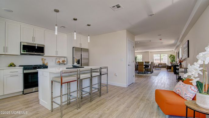 Dining room, Interior, Kitchen, Pendant Lights, Recessed Lighting, Stainless Steel Appliances, Wood Texture Flooring