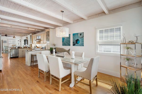 Chandelier, Dining room, Interior, Kitchen, Pendant Lights, Stainless Steel Appliances, Wooden Beams, Wood Texture Flooring