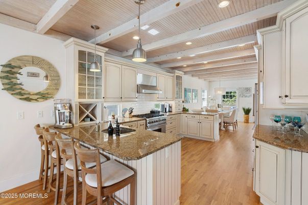 Chandelier, Dining room, Interior, Kitchen, Pendant Lights, Recessed Lighting, Stainless Steel Appliances, Wooden Beams, Wooden Ceilings, Wood Texture Flooring