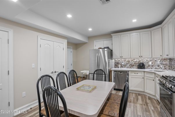 Dining room, Interior, Kitchen, Recessed Lighting, Stainless Steel Appliances, Wood Texture Flooring