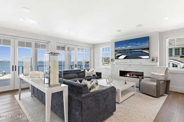 Fireplace, Interior, Living room, Recessed Lighting, Water, Wood Texture Flooring
