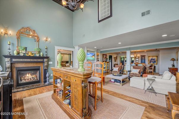 Chandelier, Dining room, Fireplace, Interior, Living room, Recessed Lighting, Wood Texture Flooring