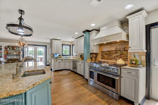 Chandelier, Interior, Kitchen, Recessed Lighting, Stainless Steel Appliances, Wood Texture Flooring