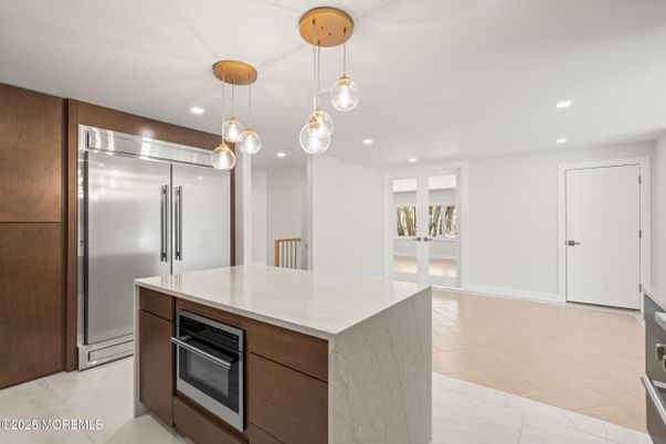 Interior, Kitchen, Marble, Pendant Lights, Recessed Lighting, Stainless Steel Appliances, Wood Texture Flooring