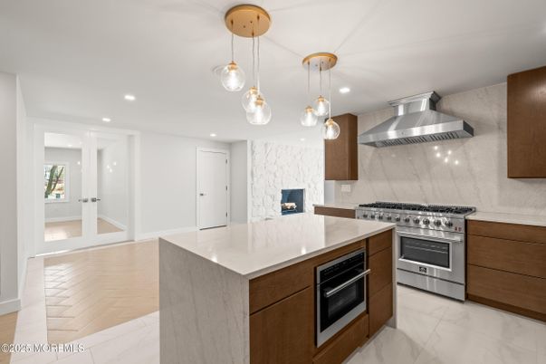 Interior, Kitchen, Marble, Marble Walls, Pendant Lights, Recessed Lighting, Stainless Steel Appliances