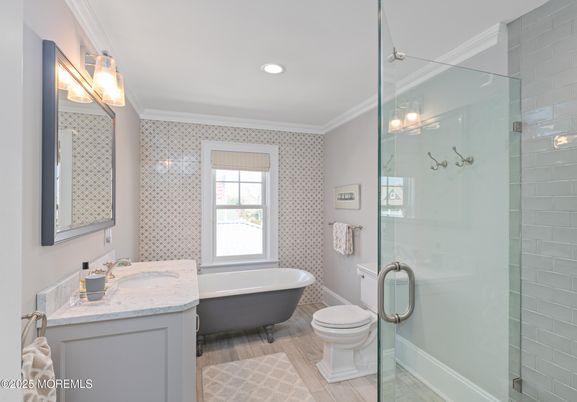 Bathroom, Free Standing Baths, Glass Shower, Interior, Recessed Lighting, Wood Texture Flooring